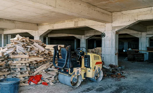 Builders and site waste on site in daylight.