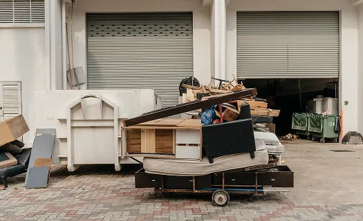 Bulky waste removal on site in daylight.